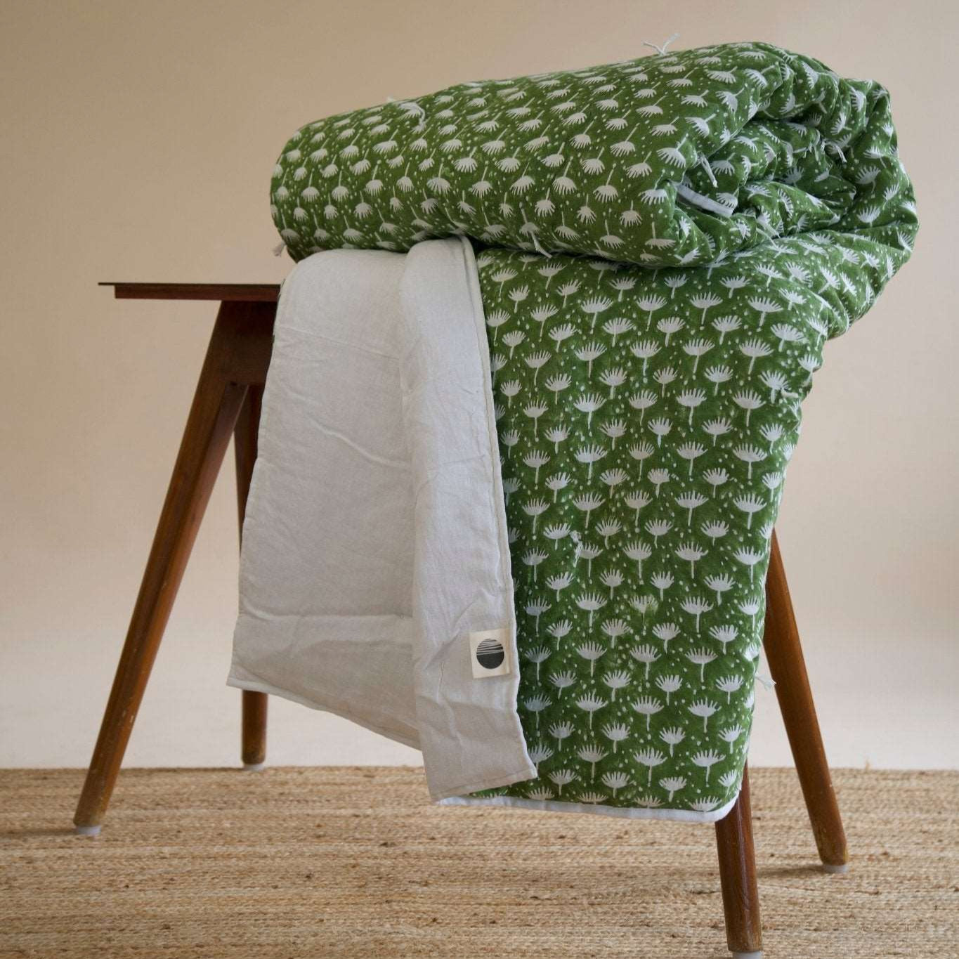 Dahlia - Hand Tucked Block Printed Linen Quilt in Kale showing the floral block prints