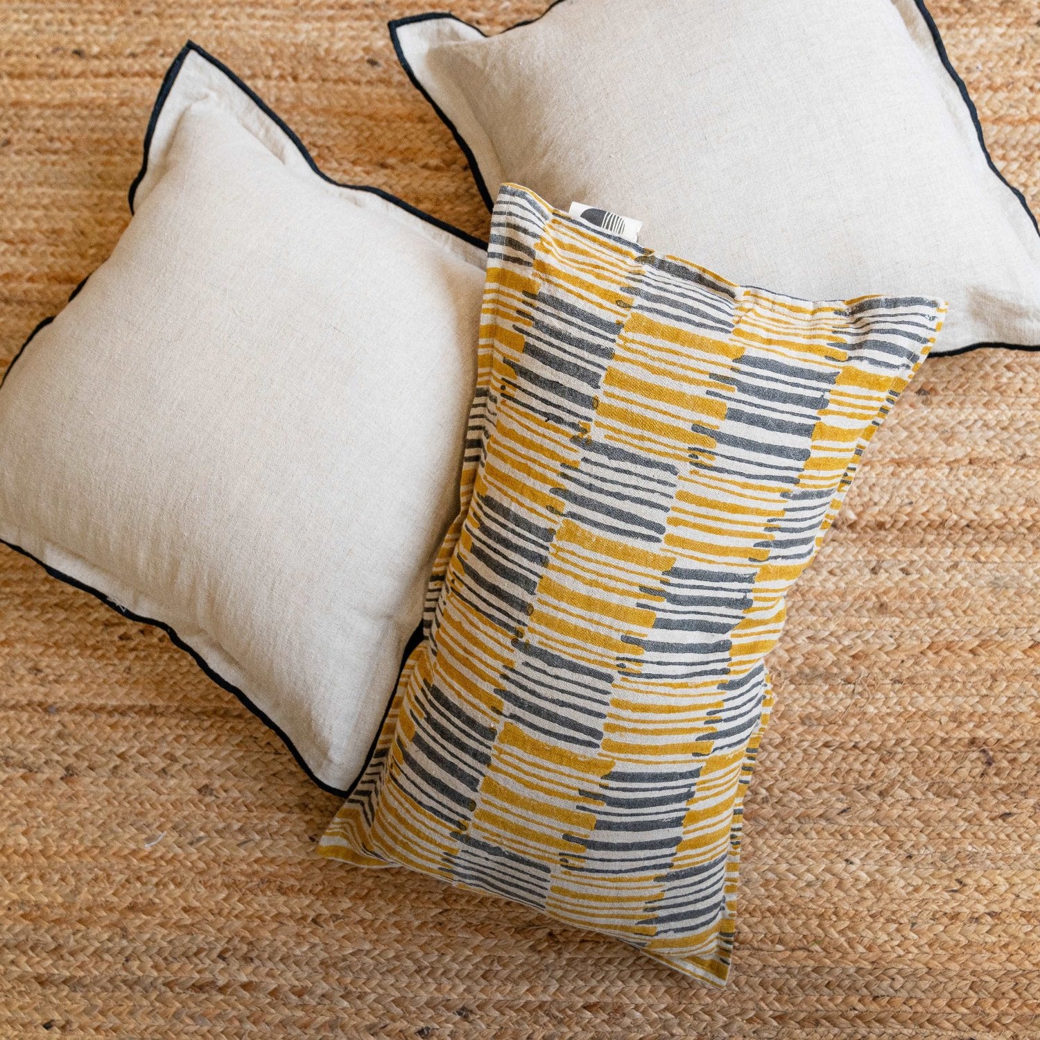 The Ochrewood cushion cover styled with matching home accessories, creating a cohesive and inviting interior design