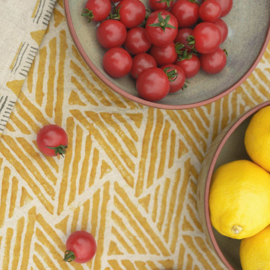 Close-up of mustard ochre table runner showcasing detailed hand block print work.