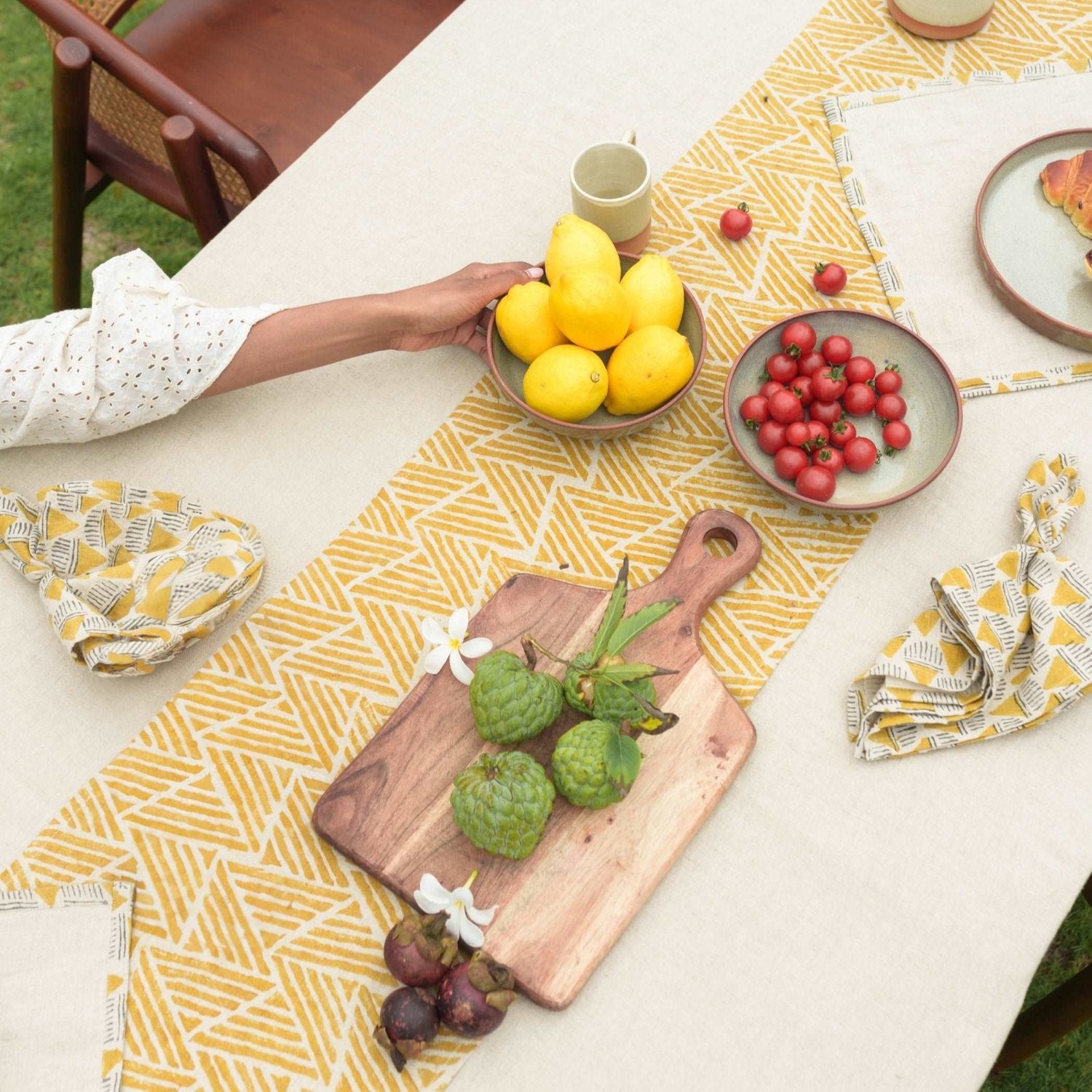 Pure linen table runner in mustard ochre styled with earthy-toned tableware.