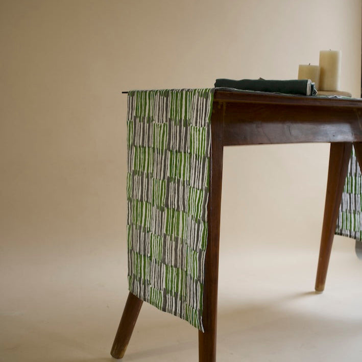 Mosswood Table Runner draped beautifully on a rustic wooden table
