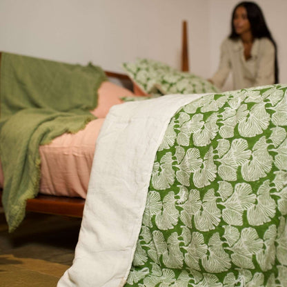 Morel quilt paired with coral pink linen pillowcases for a serene, minimalist look