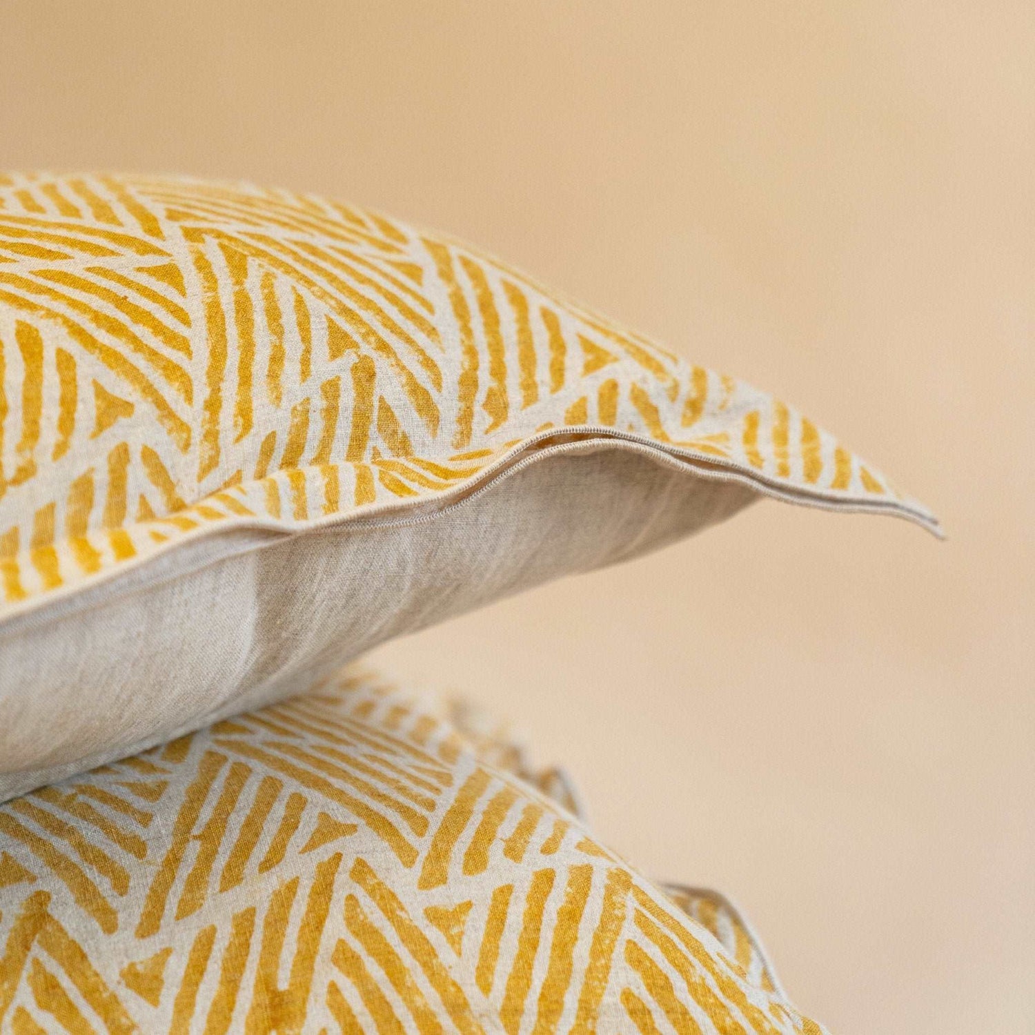 Close-up of Amberleaf Hand Block Print on Mustard Ochre Linen Cushion Cover