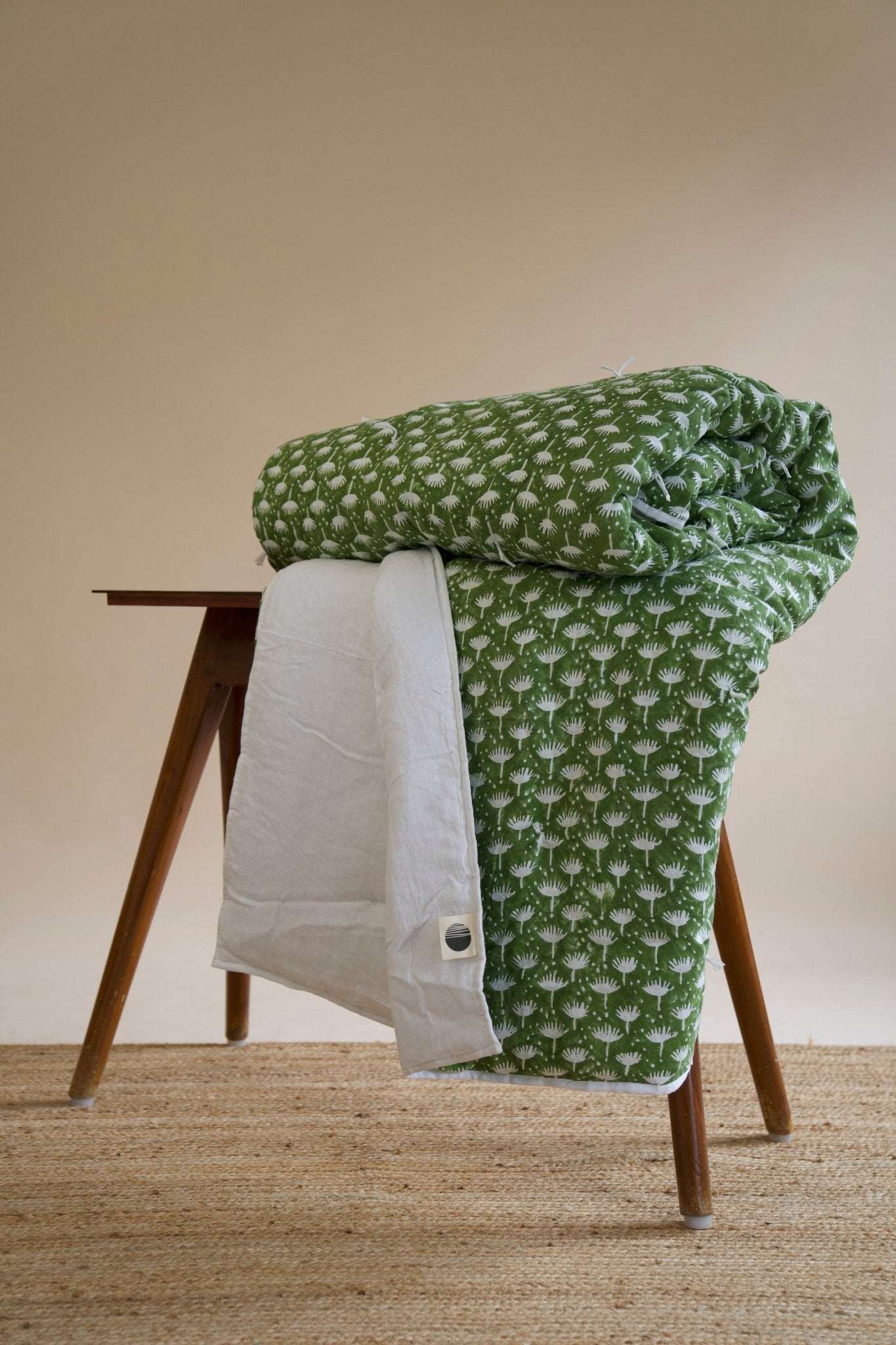 Dahlia - Hand Tucked Block Printed Linen Quilt in Kale showing the floral block prints 