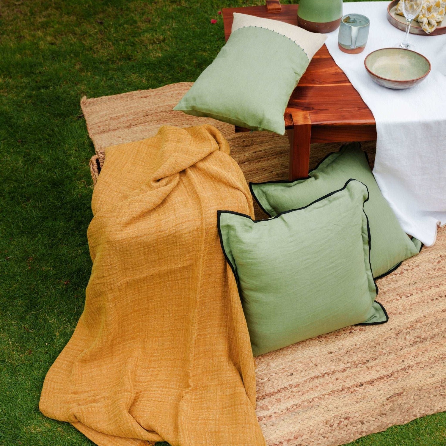 Double Layered Textured Linen Throw in Golden Ochre  in a picnic setting aesthetic