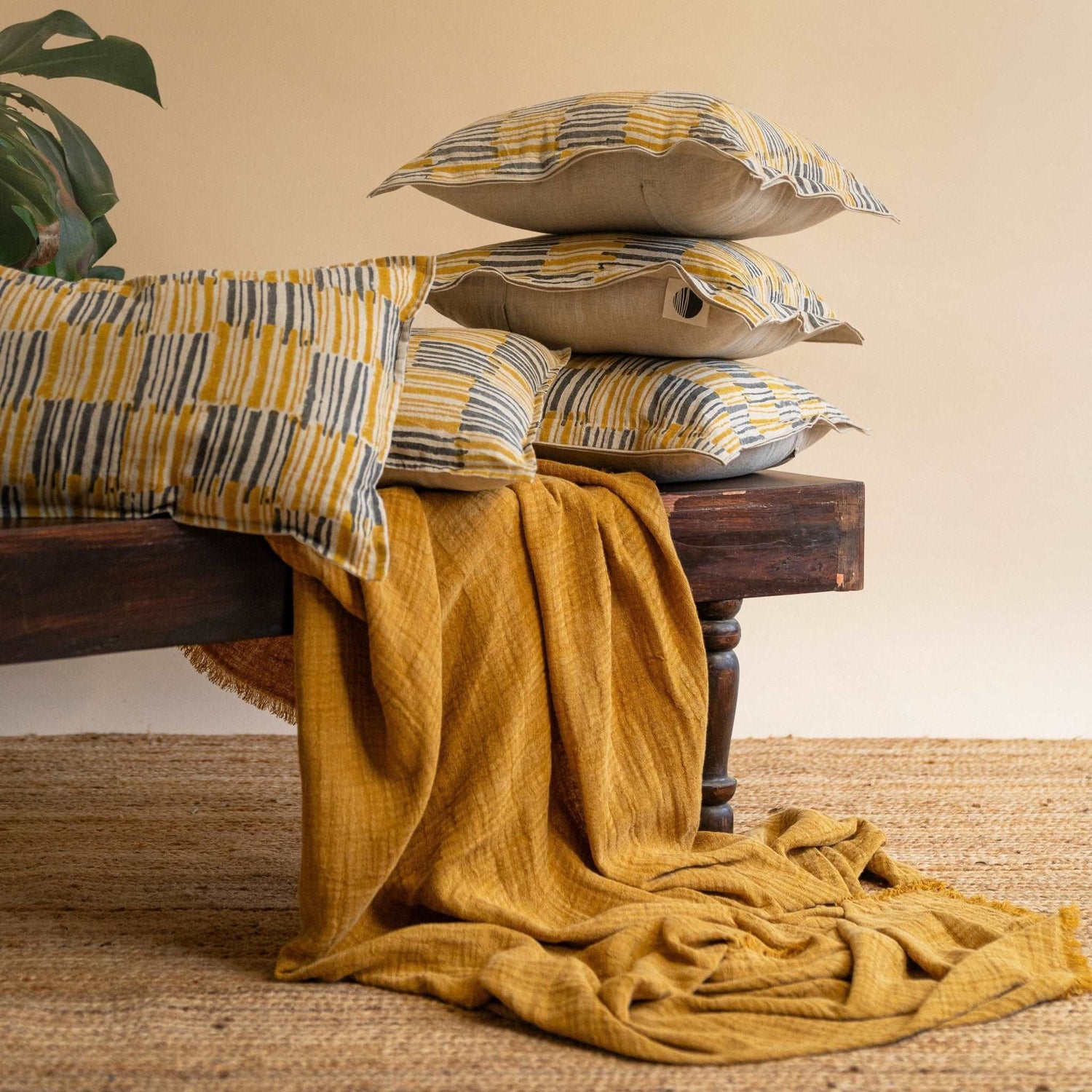 Double-layered linen and cotton slub throw in Mustard Ochre displayed in a cozy living room setting