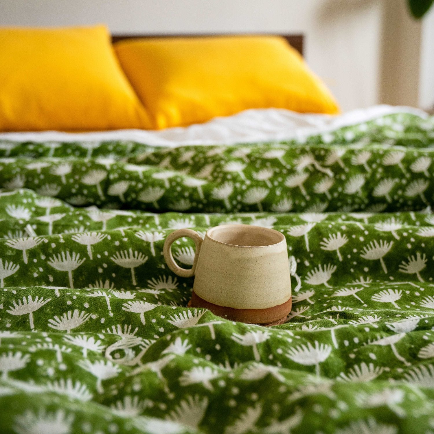 Yellow sheet set styled in a cheerful bedroom setting.