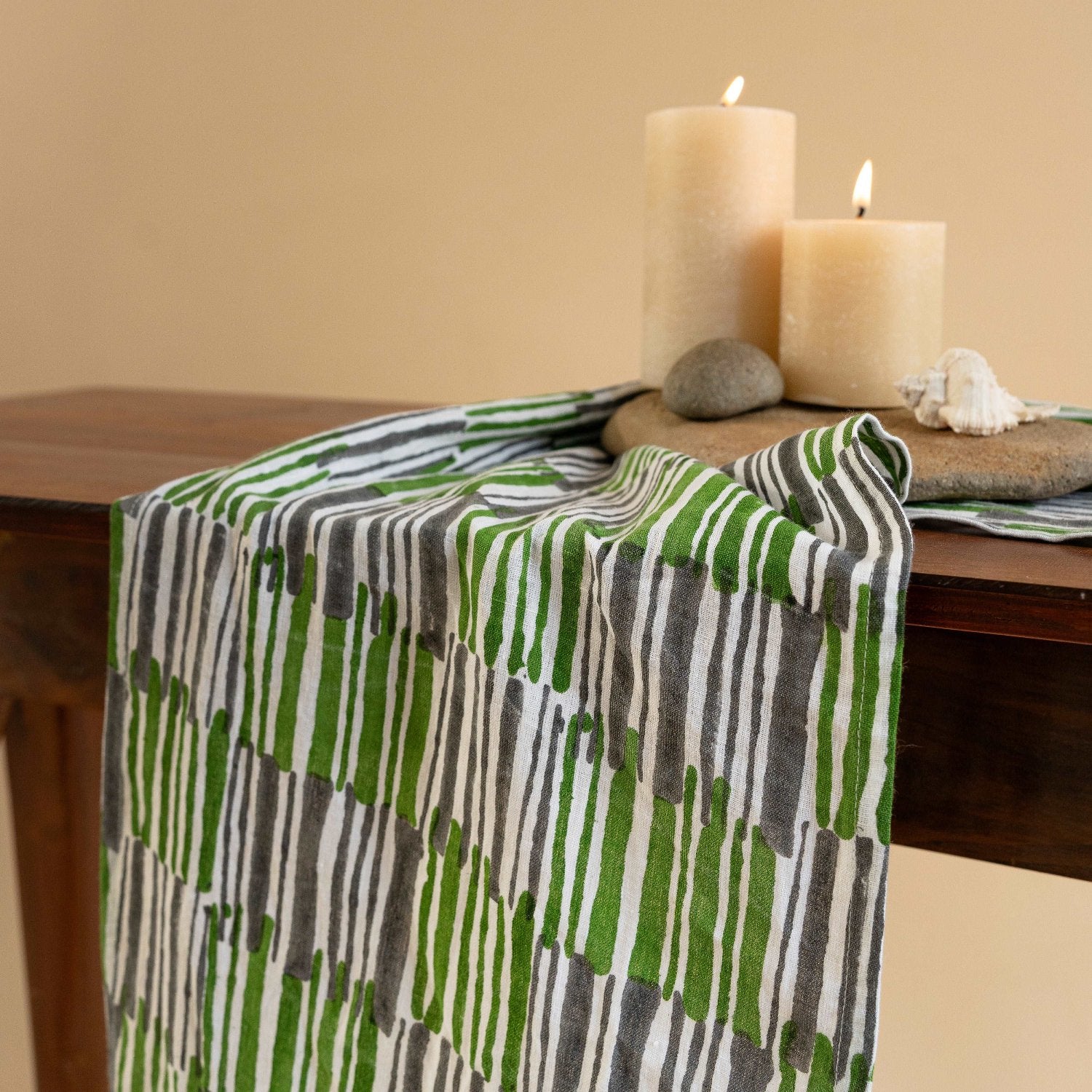 Close-up of kale green table runner showcasing intricate hand block print details.