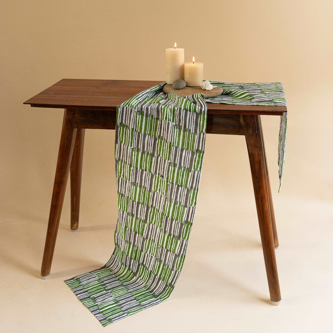 Hand block printed pure linen table runner in kale green on a 4-6 seater dining table.