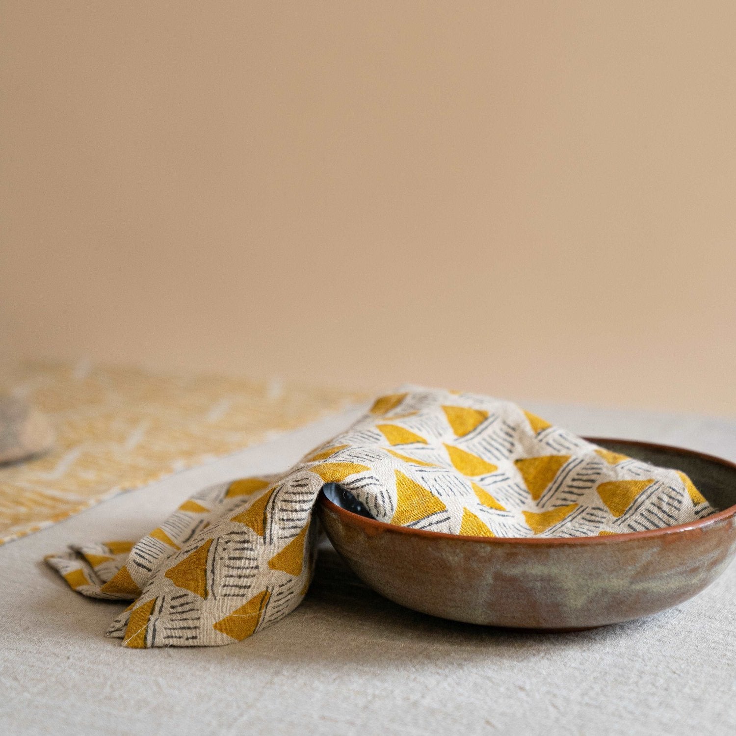 Prisma napkin flowing out of a bowl, adding a playful touch to the table decor.