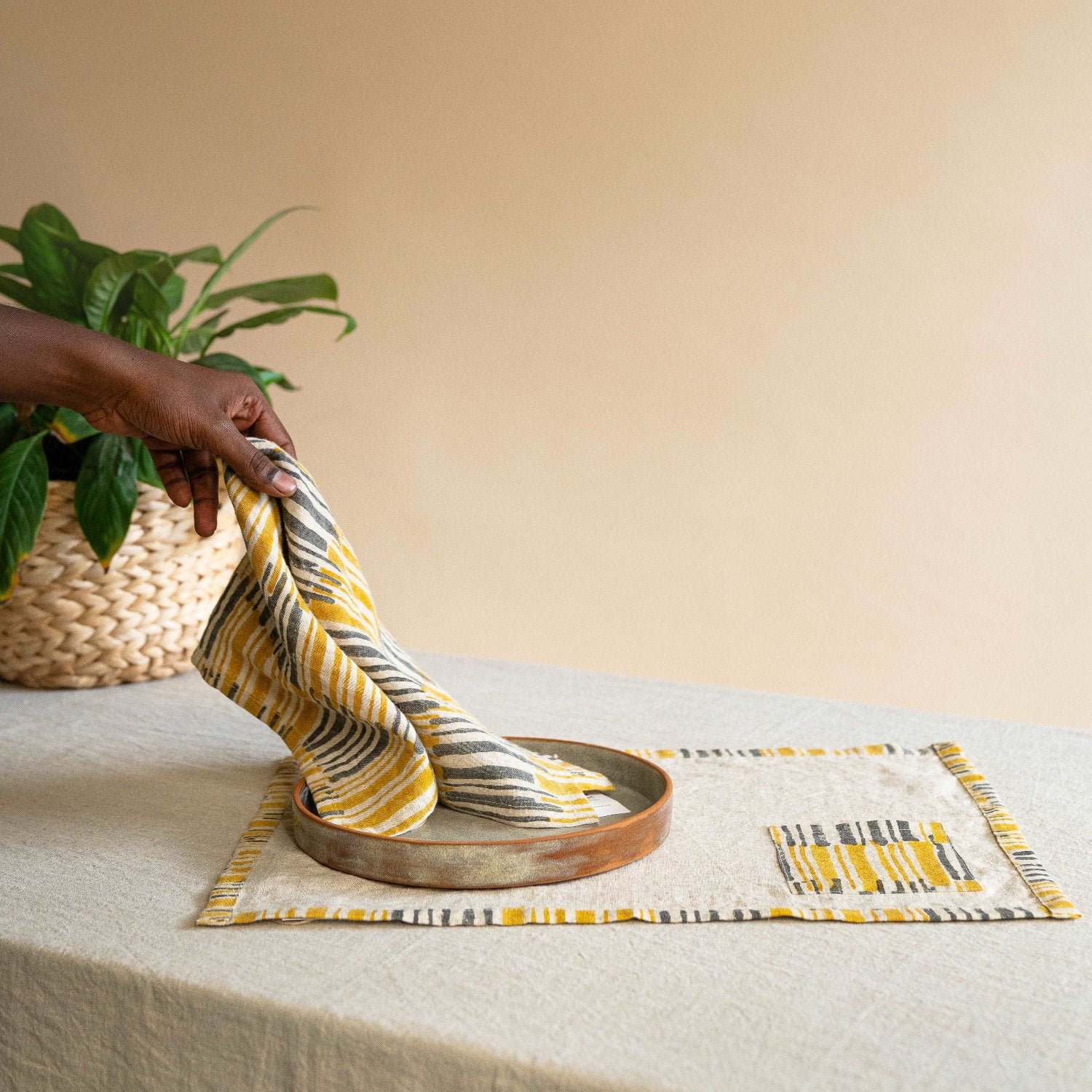 Ochrewood napkin paired with a matching placemat for an elegant tablescape.