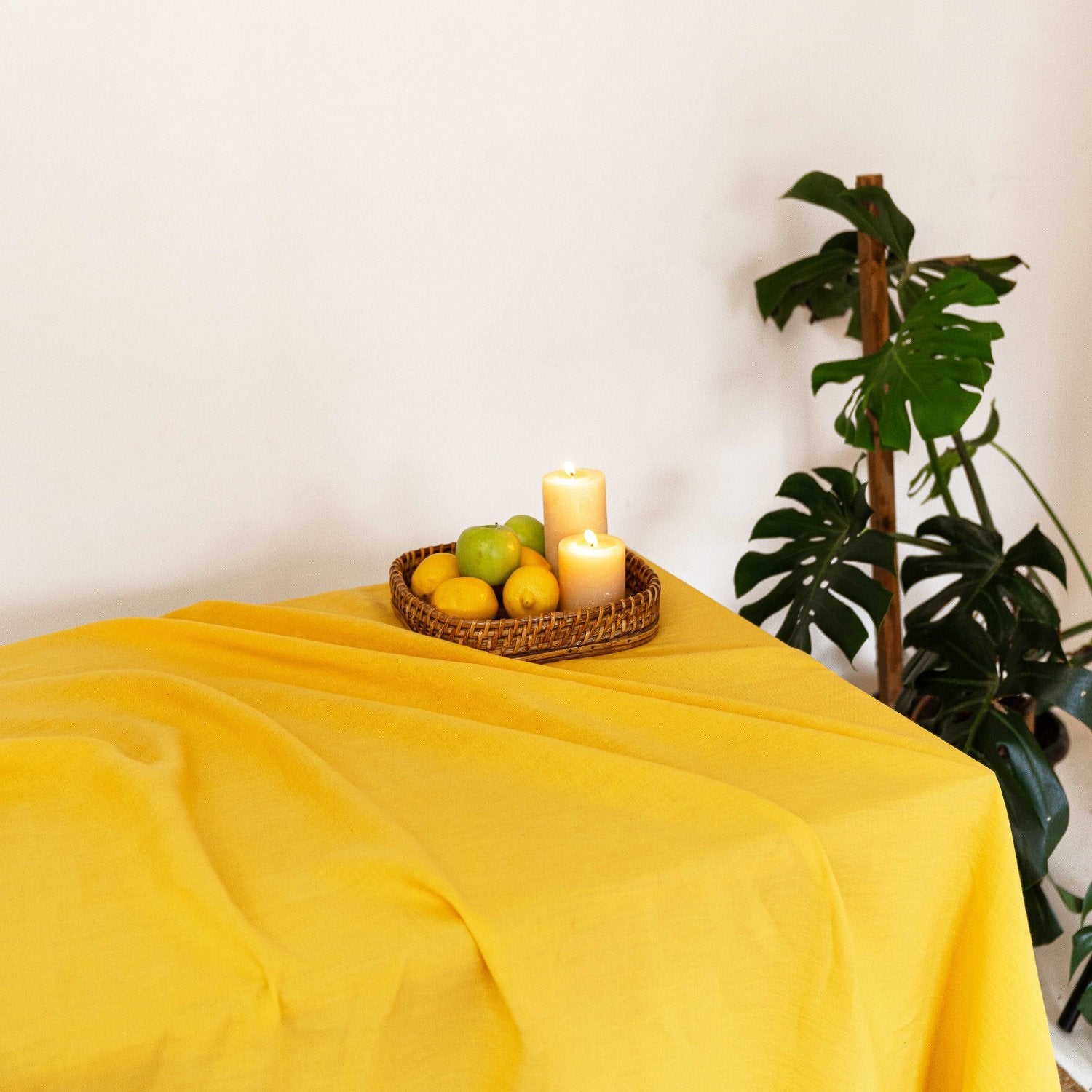 Close-up of summer yellow linen tablecloth texture, highlighting its vibrancy.