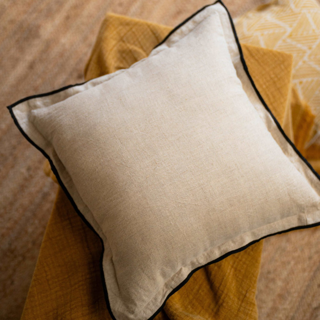 Front view of the Oatmeal solid linen cushion cover, showcasing its natural beige hue and minimalist design.