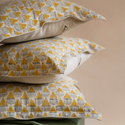 Stack of Prisma cushion covers with fillers neatly stacked, showcasing the consistency of the hand block printed pattern.