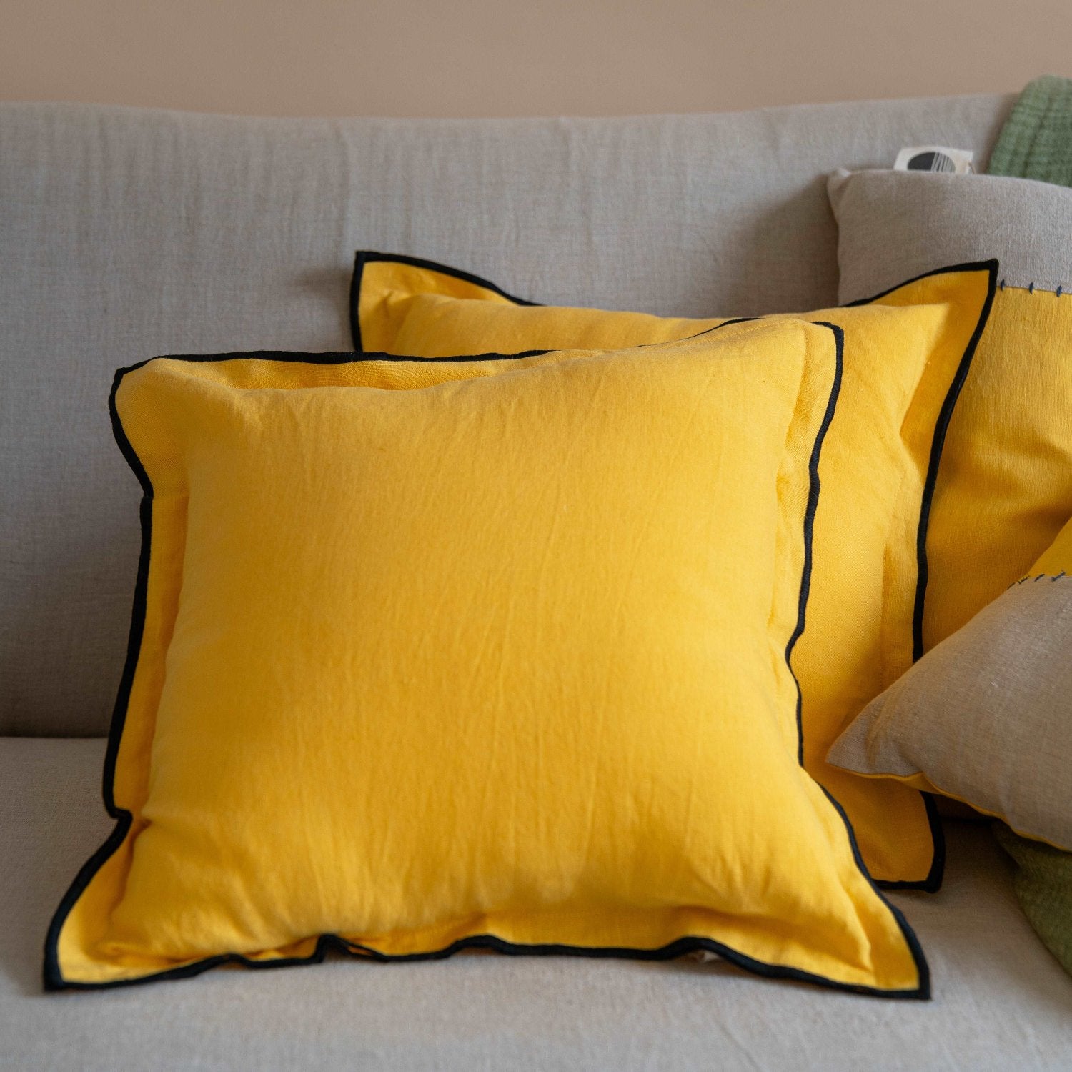 Front view of the Summer Yellow solid linen cushion cover, showcasing its vibrant yellow hue and minimalist design.