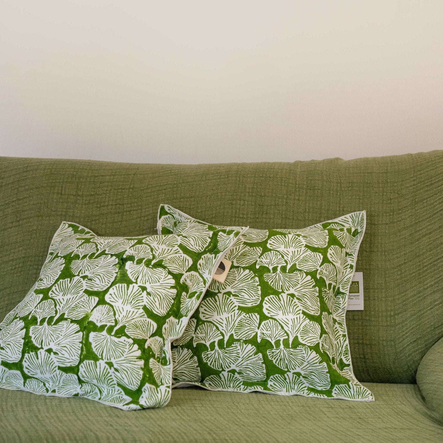 Set of Morel hand block printed linen cushion covers in kale green, arranged neatly to showcase both design and attention to detail.