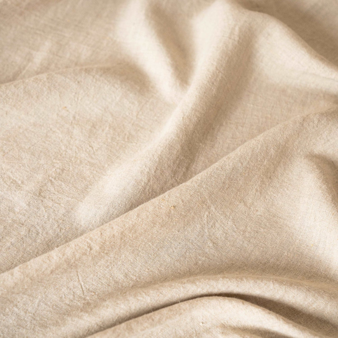 close up look of the beige bed sheet all lived in